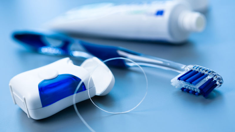 Brushing or flossing
